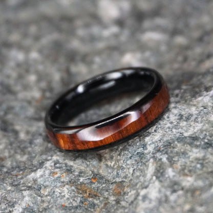Black comfort fit ring with a wood inlay, 6mm width, by Forge and Lumber. Available in sizes UK K to M.