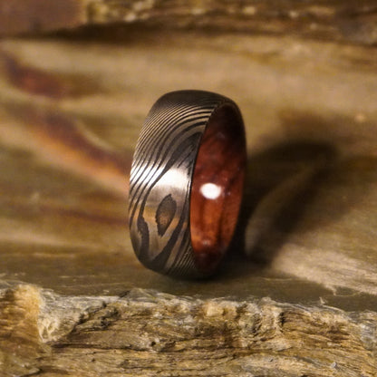 Damascus steel commitment ring with a wooden interior by Forge and Lumber, available in sizes UK M, N, O.