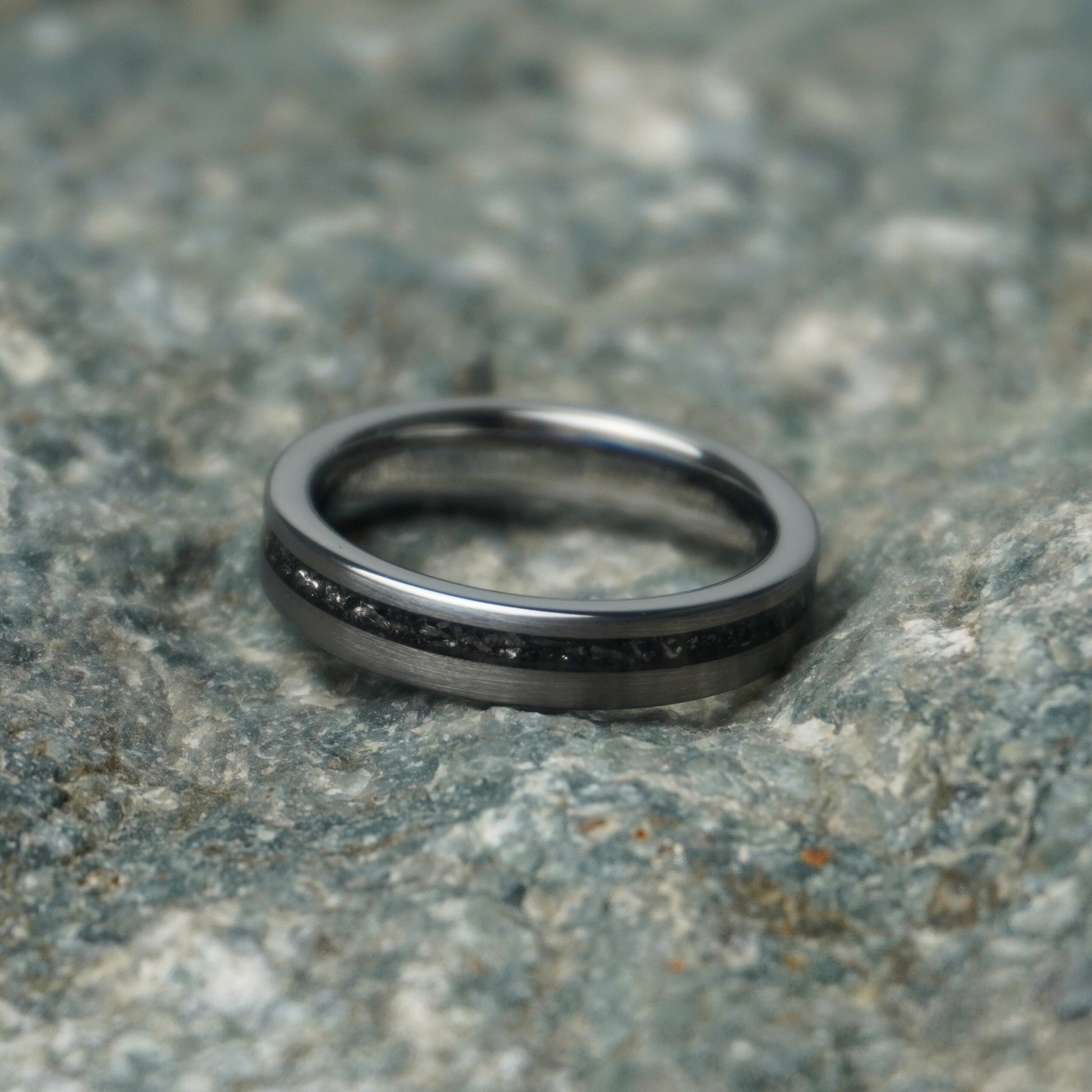 Black 4mm wedding band with a celestial design by Forge and Lumber.