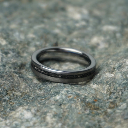 Black 4mm wedding band with a celestial design by Forge and Lumber.