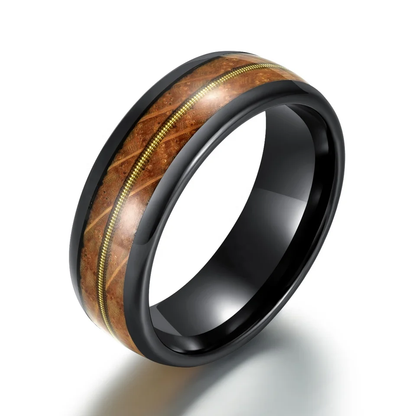 Black ceramic wedding band with wood inlay and gold accents by Forge and Lumber, available in sizes UK M to O.
