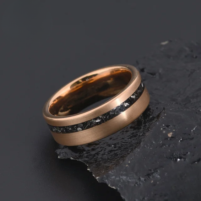 Rose gold 8mm wedding band with black stone inlay by Forge and Lumber.