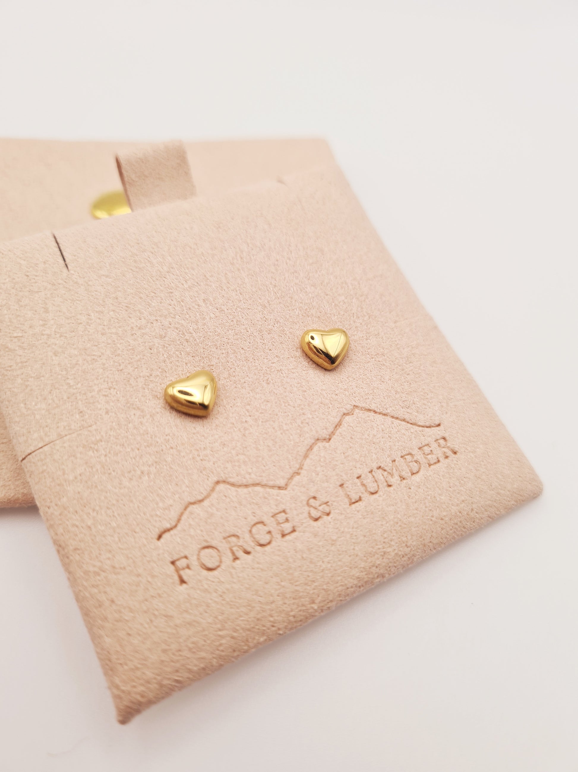 18K gold plated heart stud earrings in stainless steel by Forge and Lumber, perfect for daily wear.
