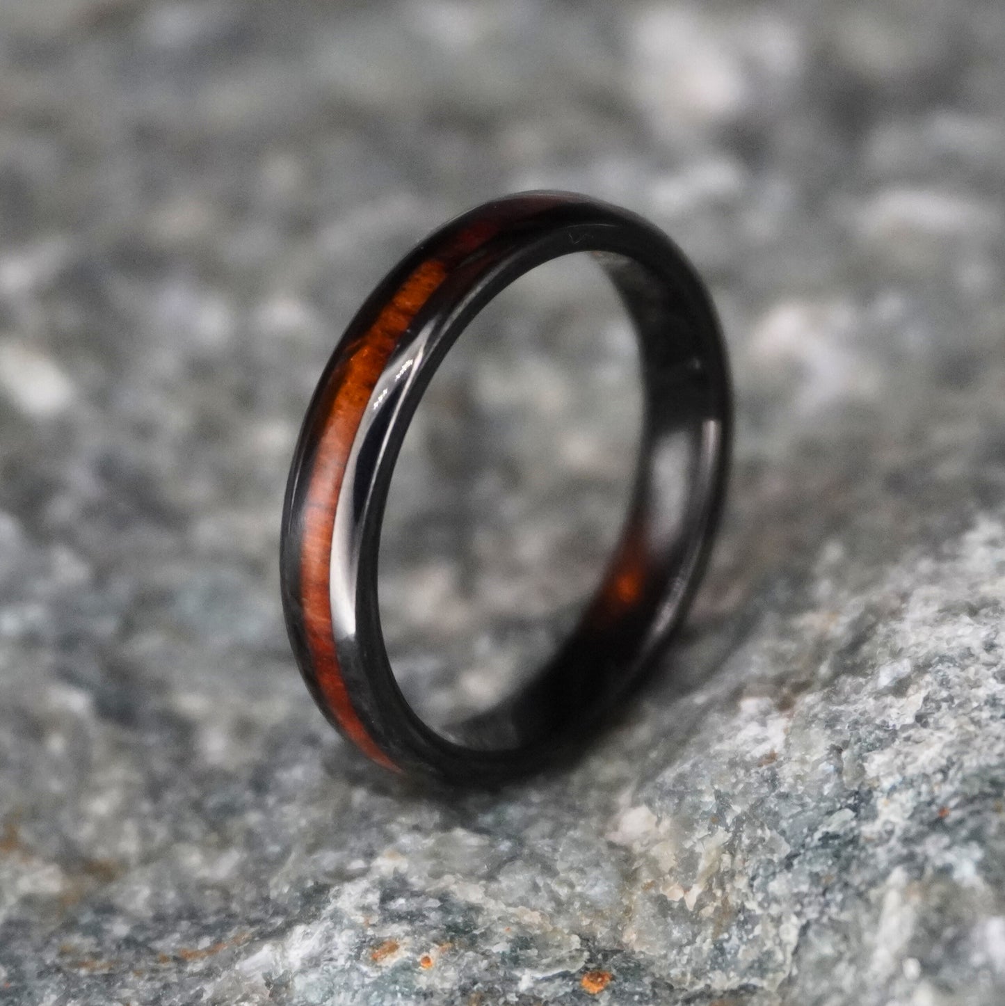 Black durable ring with a Hawaiian wood inlay, 4mm width, by Forge and Lumber.