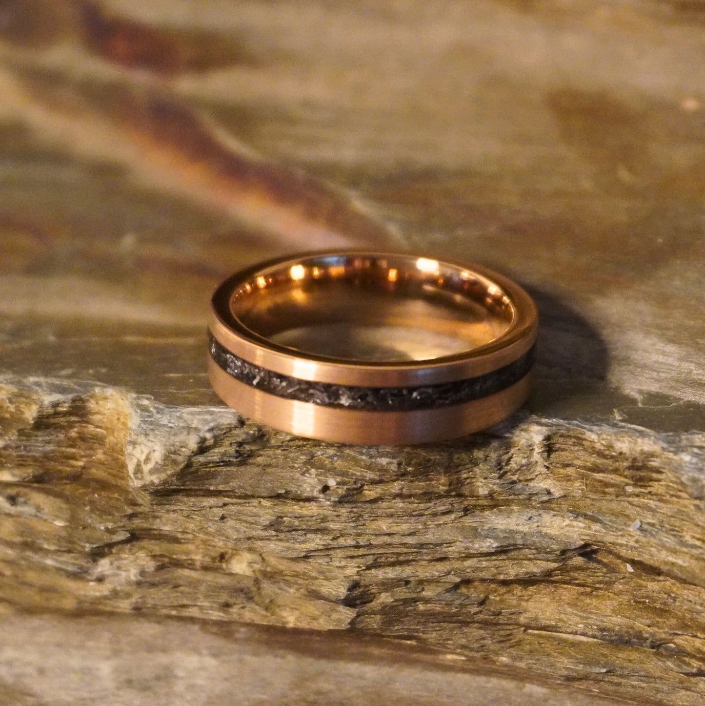 Rose gold plated tungsten ring with a 6mm band and meteorite inlay by Forge and Lumber.