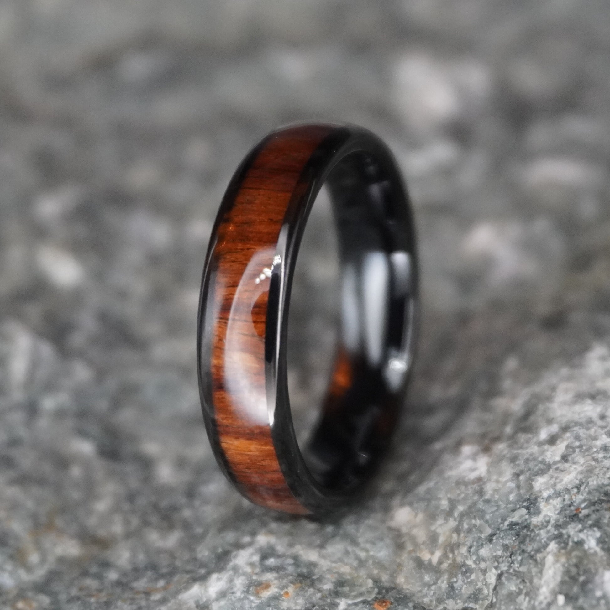 Black comfort fit ring with a wood inlay, The Warrior by Forge and Lumber, 6mm width.