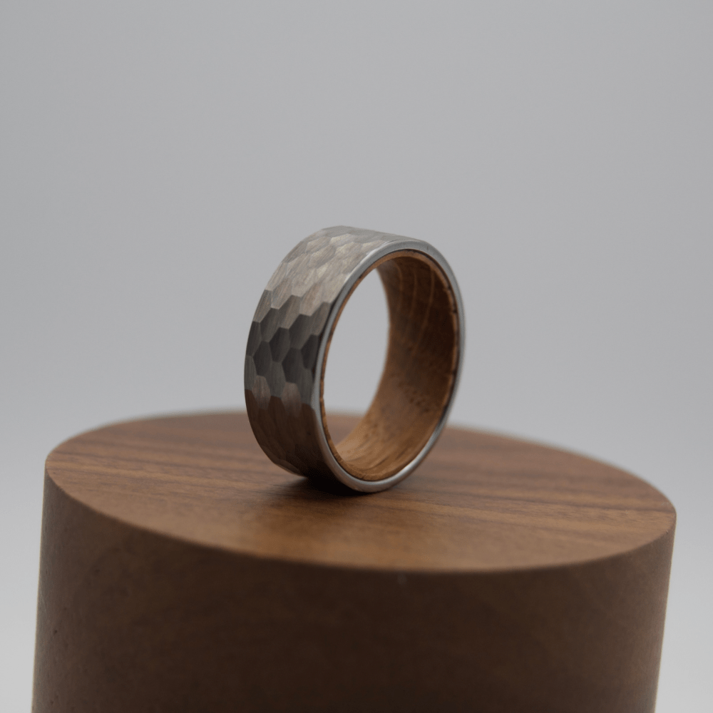 Hammered silver ring with wooden interior, from Forge and Lumber, available in sizes UK M, N, O.