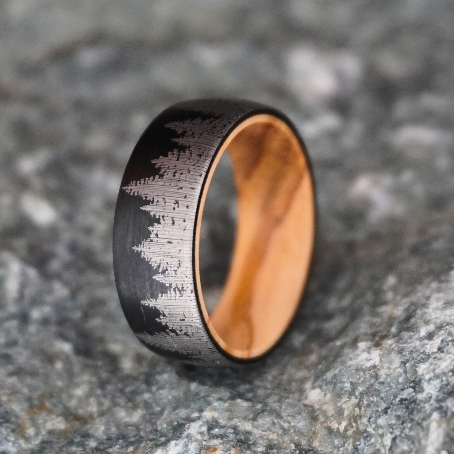 Black 8mm ring with engraved mountain design, featuring a durable finish by Forge and Lumber.