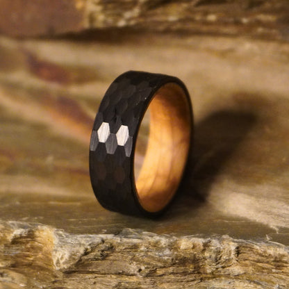 Black 8mm flat ring with hexagonal pattern and wooden interior by Forge and Lumber.