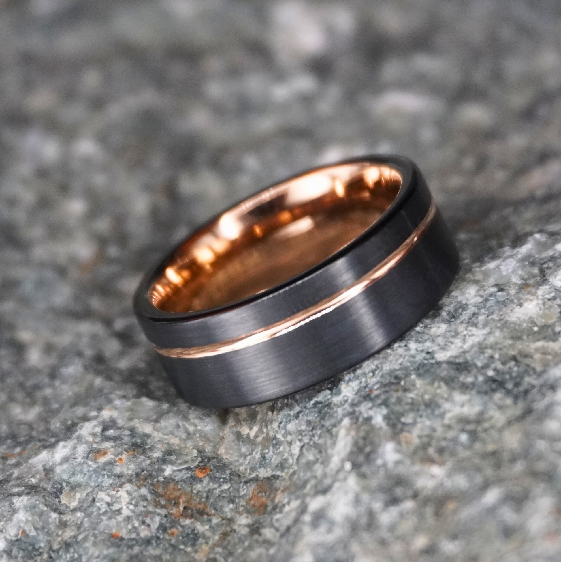 Black and rose gold 8mm wedding band with a blacksmith-inspired design by Forge and Lumber.