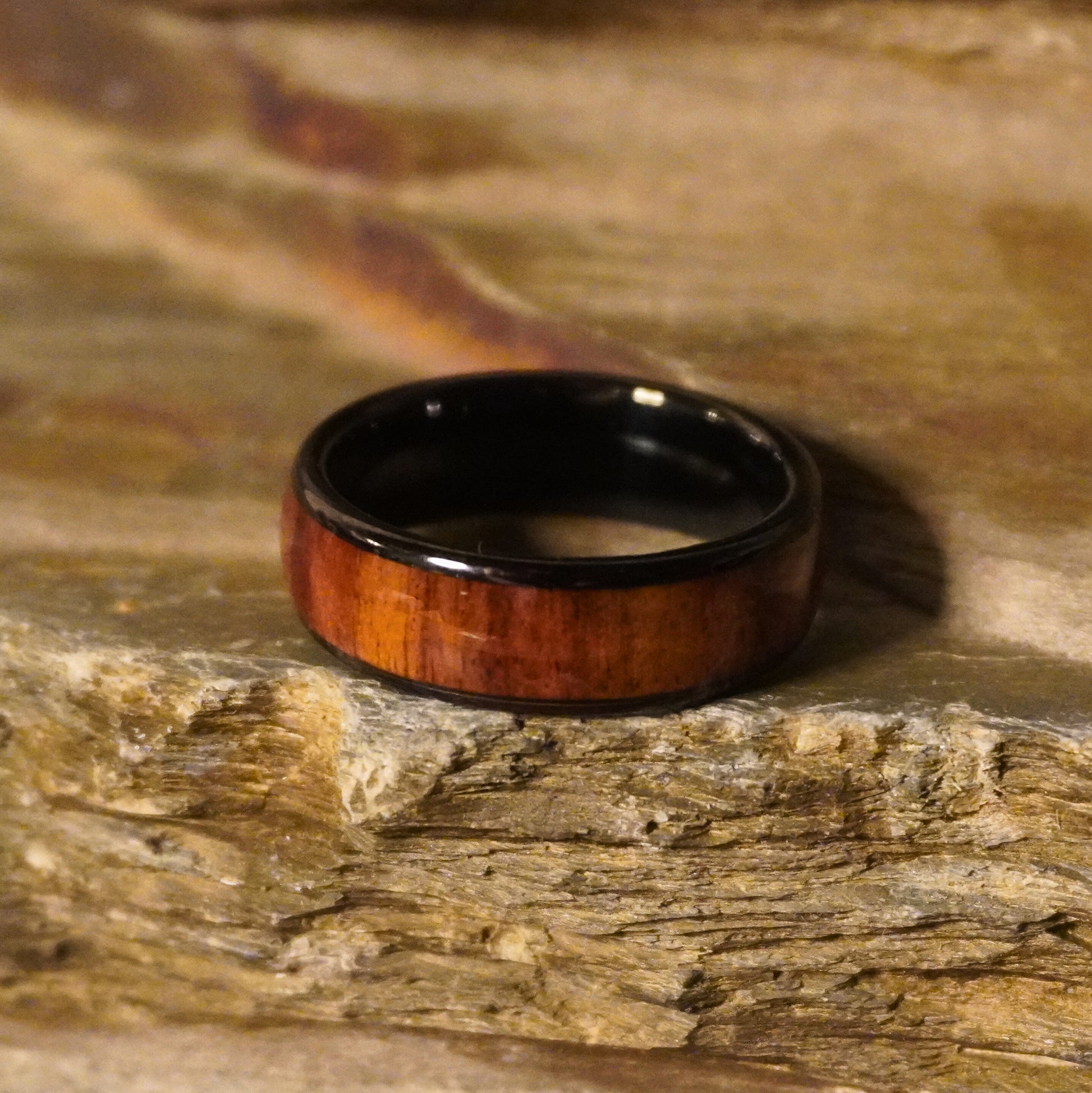 Black tungsten comfort-fit ring with 8mm width and wooden inlay by Forge and Lumber.