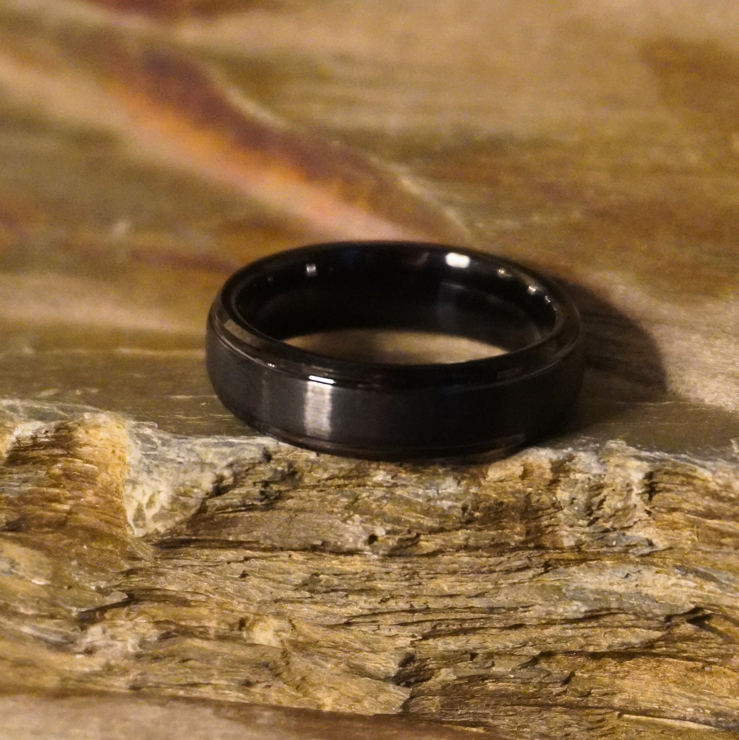 Black beveled ring from Forge and Lumber, 6mm, affordable luxury design.