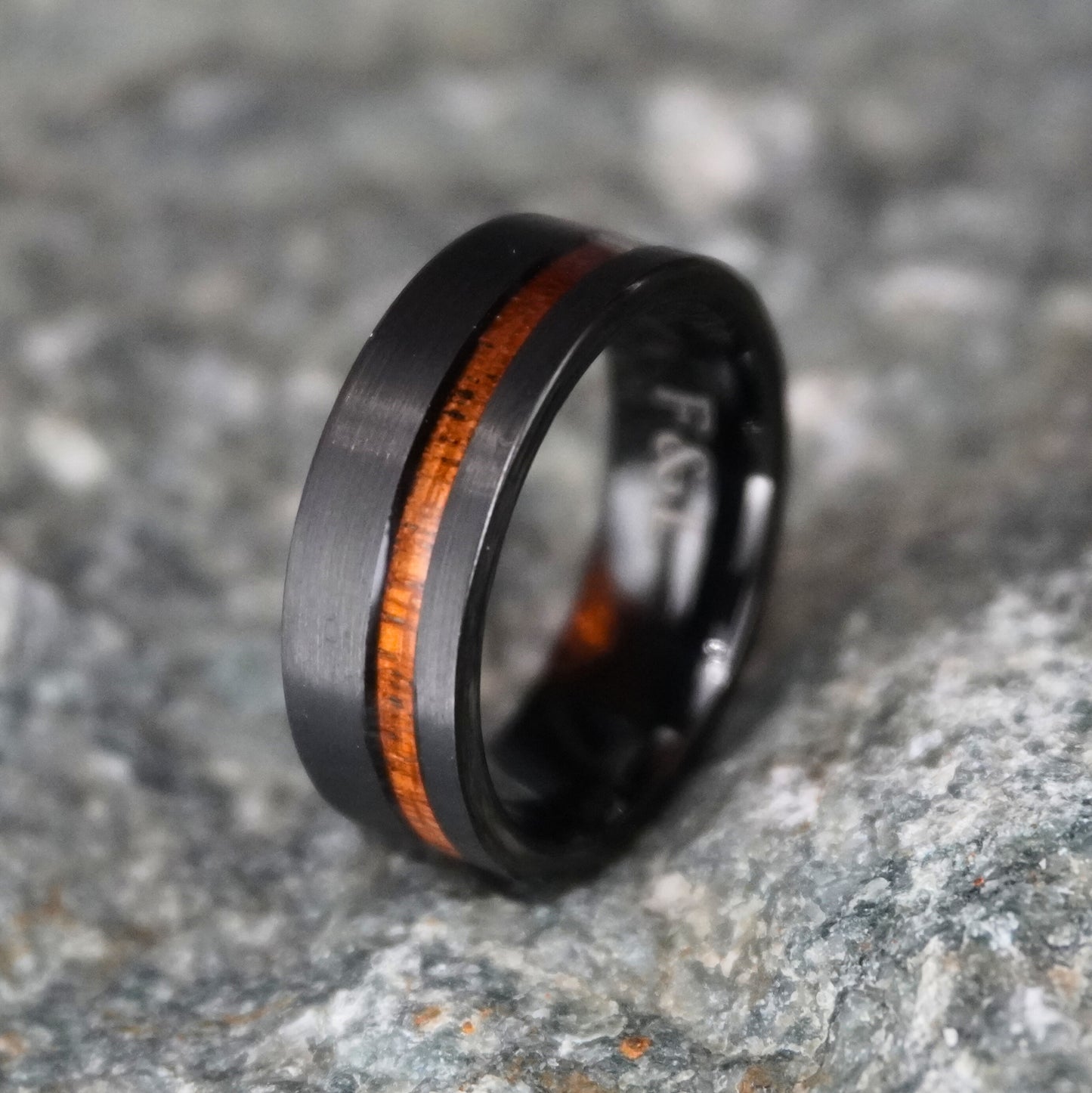 Black brushed finish 8mm ring with a wood inlay by Forge and Lumber, available in sizes UK M to O.