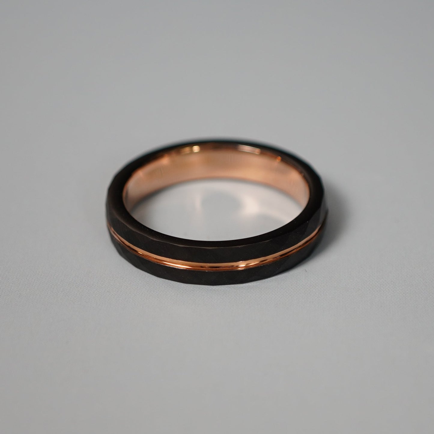 Black and rose gold engraved wedding band by Forge and Lumber, 4mm delicate design, available in sizes UK I to K.