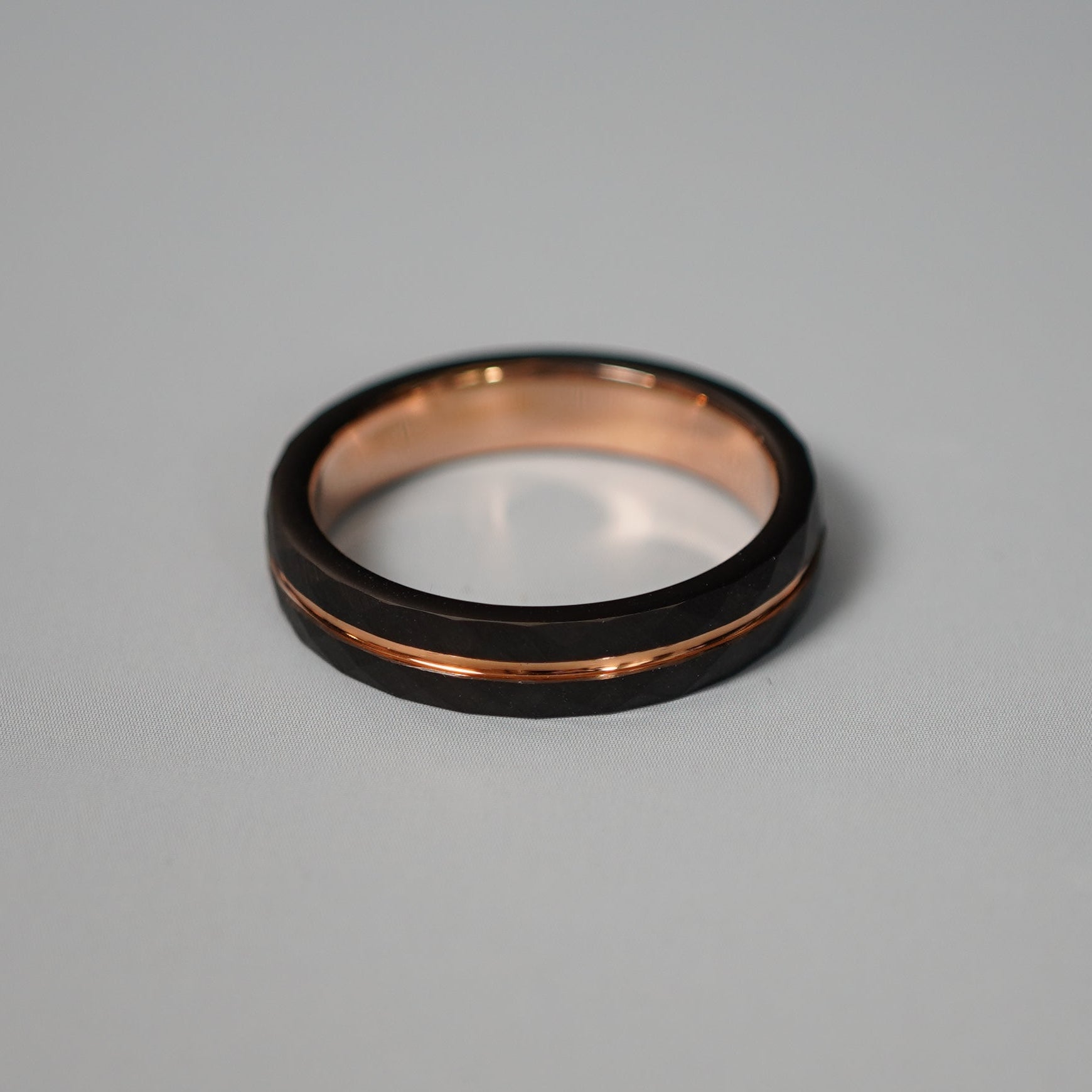 Black and rose gold engraved wedding band by Forge and Lumber, 4mm delicate design, available in sizes UK I to K.