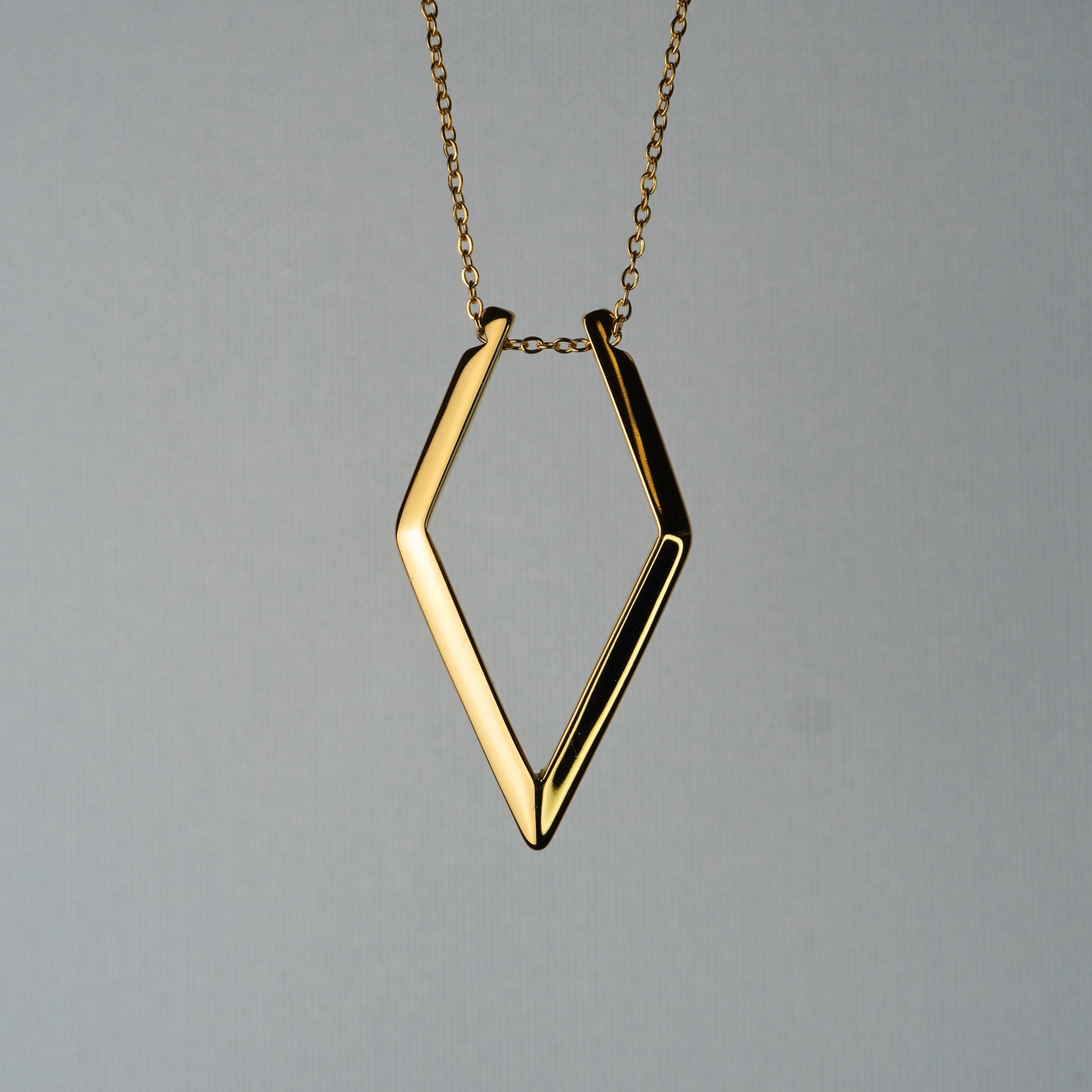 18K gold plated ring holder necklace with adjustable chain from Forge and Lumber, featuring tarnish-free design.