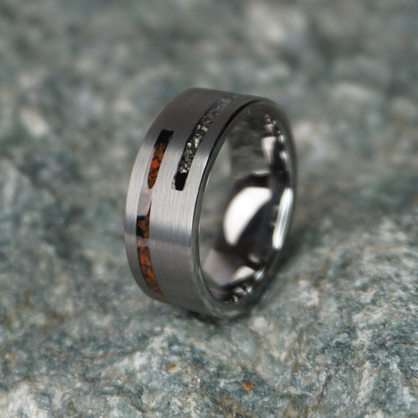 Engravable 8mm ring featuring cosmic Dinosaur Bone inlay, by Forge and Lumber, available in sizes UK M, N, O.