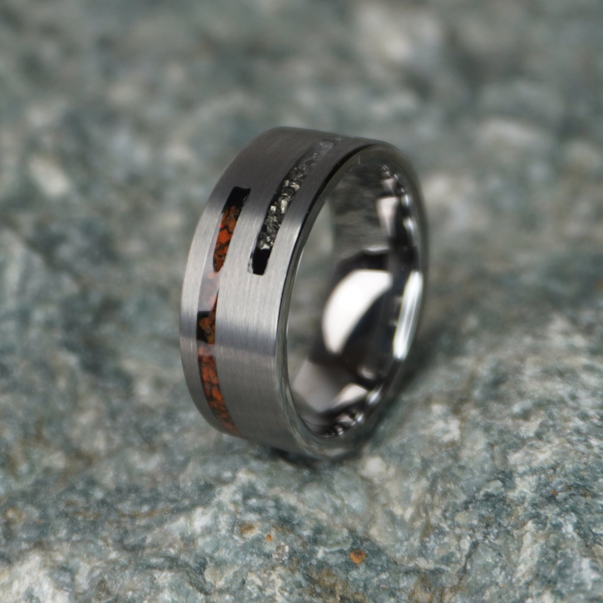 Engravable 8mm ring featuring cosmic Dinosaur Bone inlay, by Forge and Lumber, available in sizes UK M, N, O.