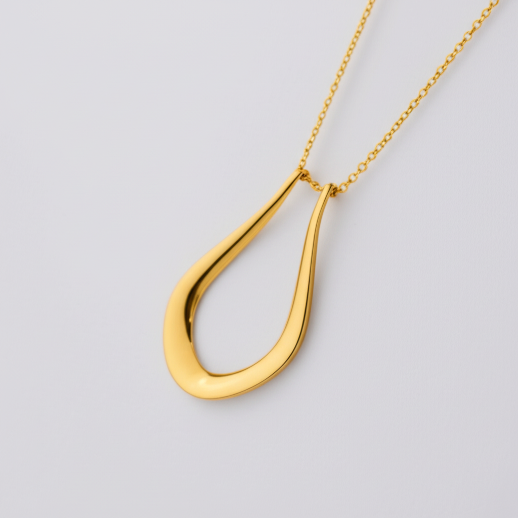 The Abalone necklace by Forge and Lumber: 18k gold plated pendant.