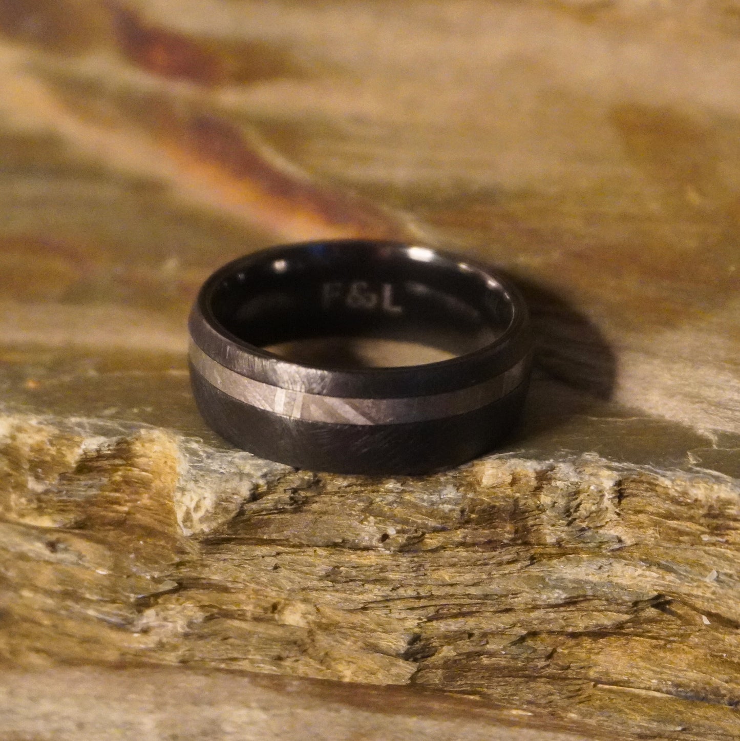 Black Zirconium ring with a brushed finish and polished stripe by Forge and Lumber, available in sizes UK N to P.