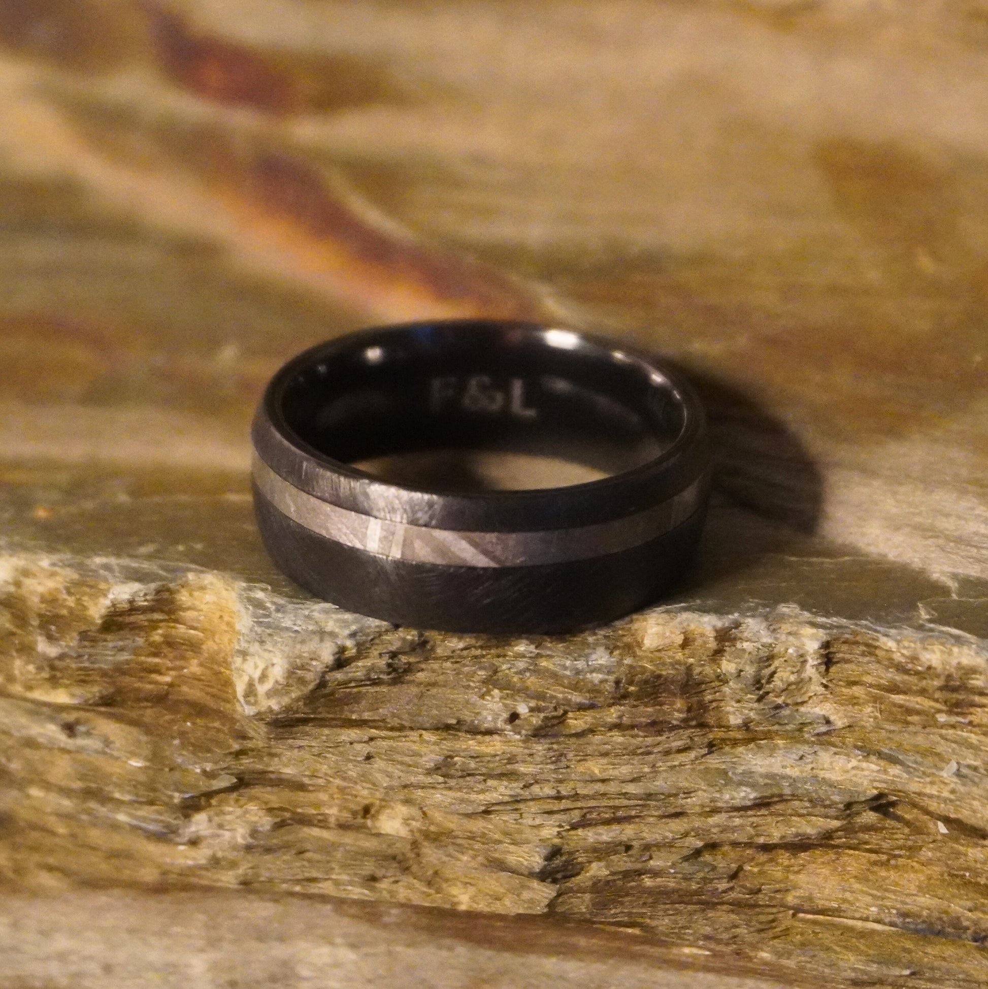 Black Zirconium ring with a brushed finish and polished stripe by Forge and Lumber, available in sizes UK N to P.