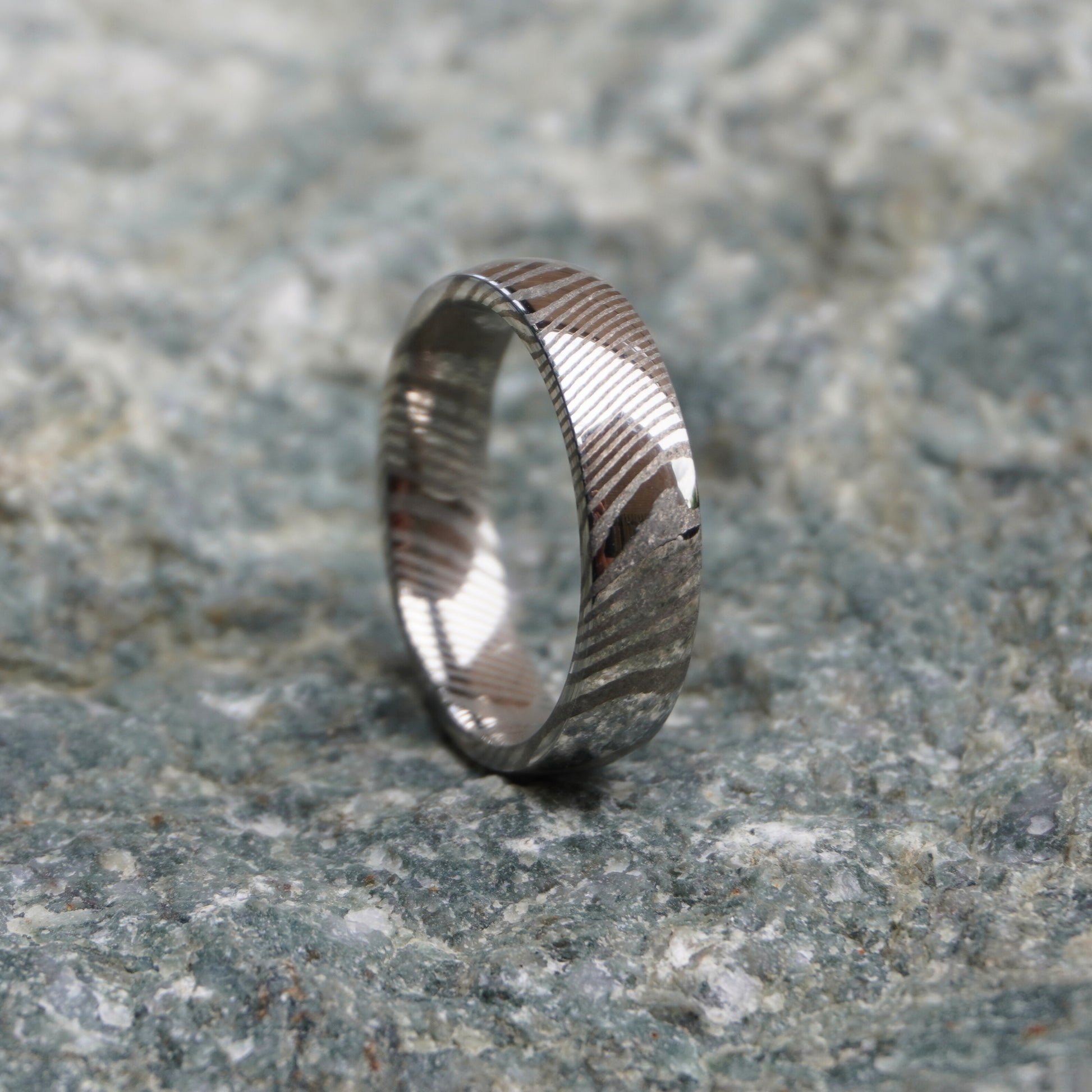 Damascus steel ring with a textured ripple design by Forge and Lumber, available in sizes UK N to P.