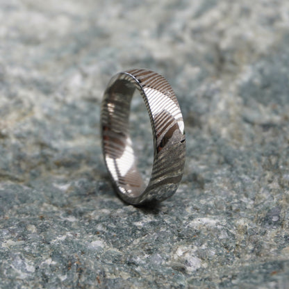 Damascus steel ring with a textured ripple design by Forge and Lumber, available in sizes UK N to P.