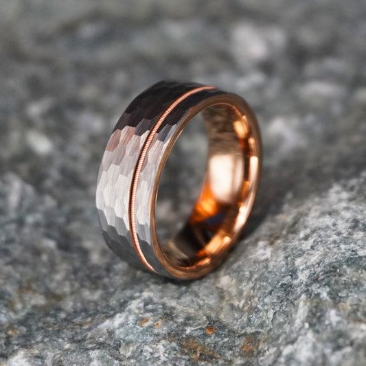 Flat gold wedding ring with a hammered texture and rose gold accent by Forge and Lumber. Size UK M / US 6.