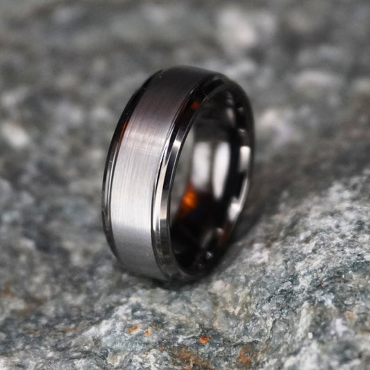Beveled black tungsten ring from Forge and Lumber, featuring a brushed finish, available in sizes UK M to O.