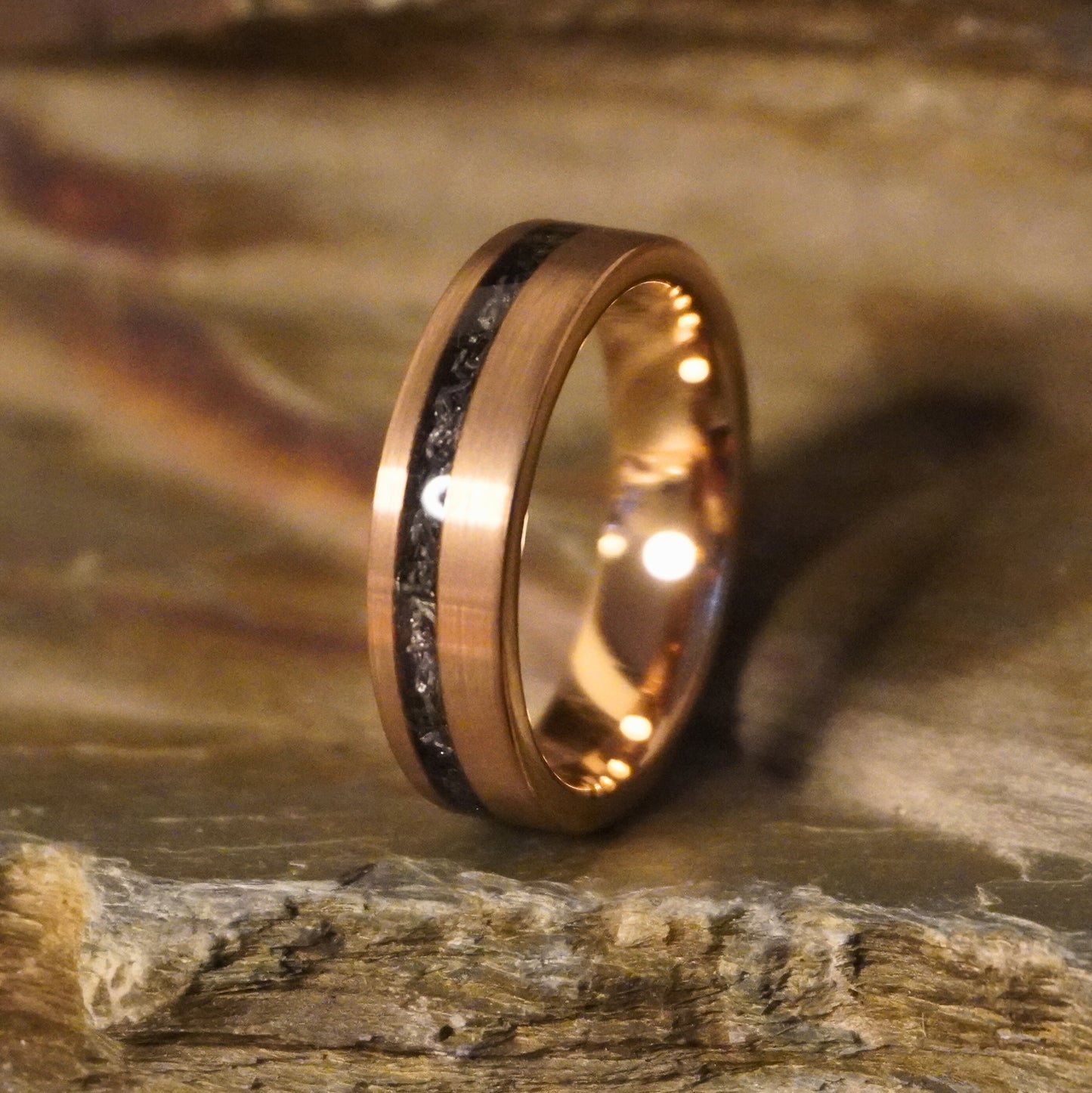 Rose gold plated tungsten ring with 6mm band and black meteorite inlay by Forge and Lumber.