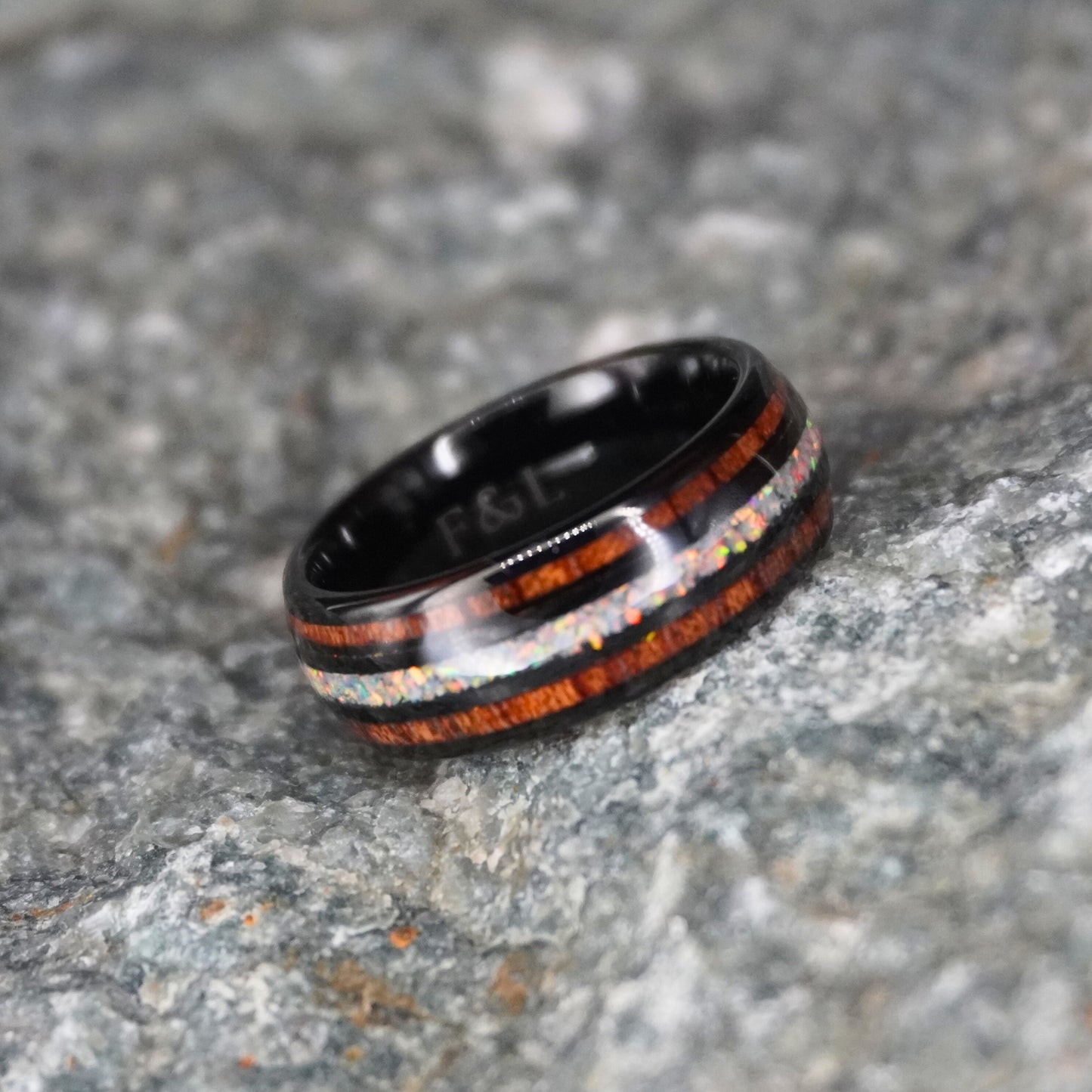 Black comfort-fit ring with double inlay, featuring wood and iridescent accents by Forge and Lumber.