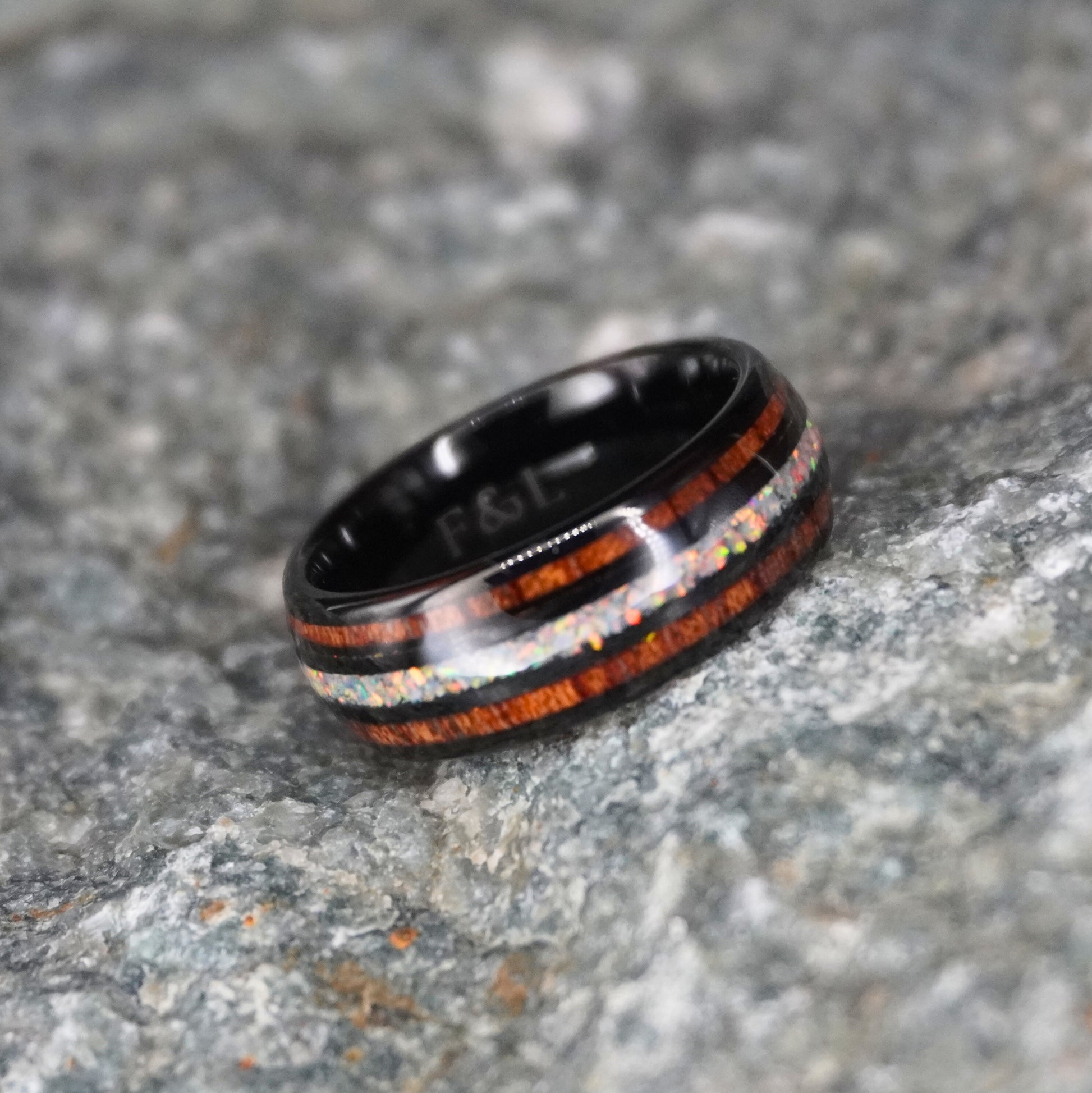 Black comfort-fit ring with double inlay, featuring wood and iridescent accents by Forge and Lumber.