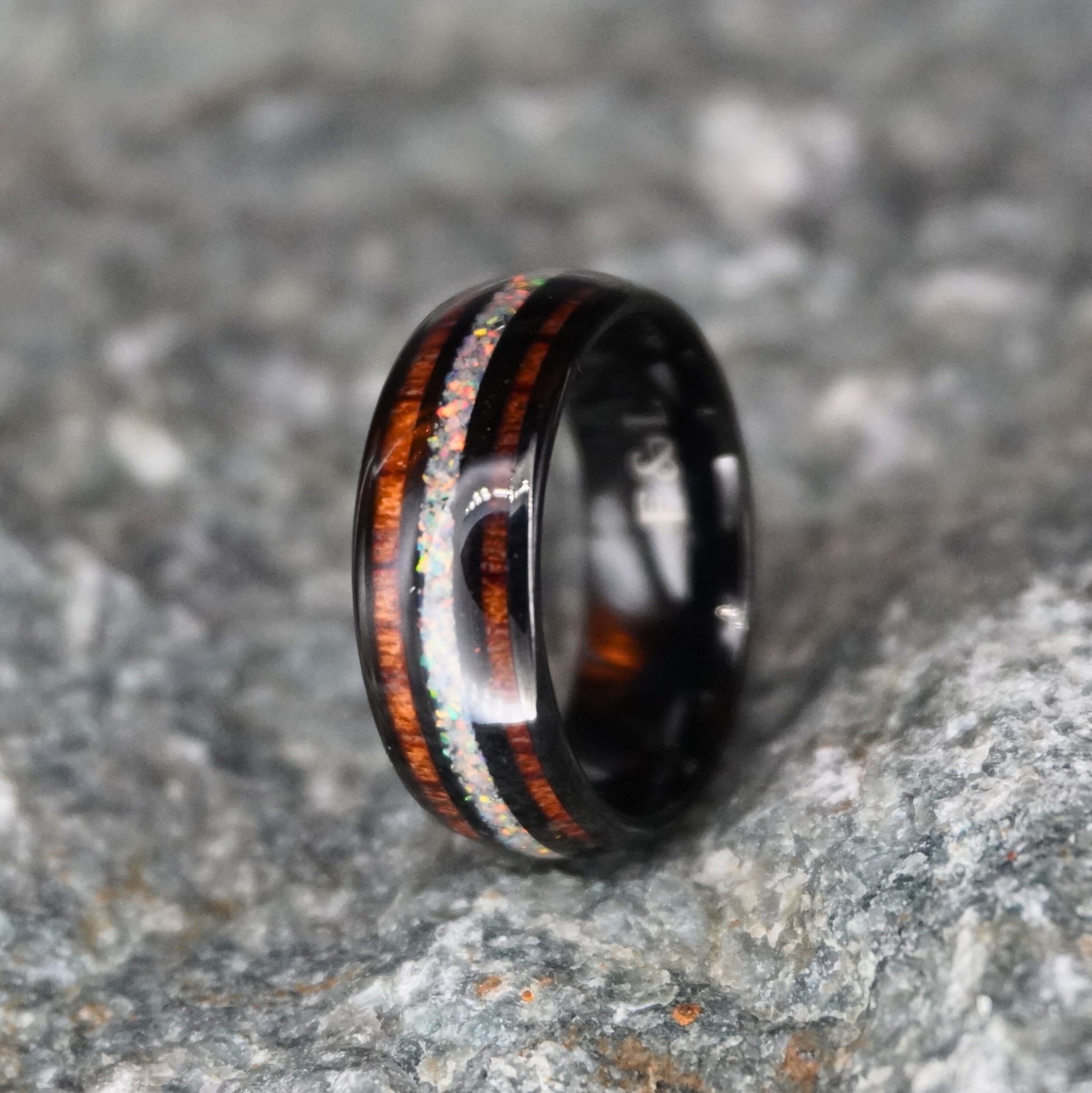 Black comfort-fit ring with double inlay, featuring wood and opal accents by Forge and Lumber. Size UK M / US 6.