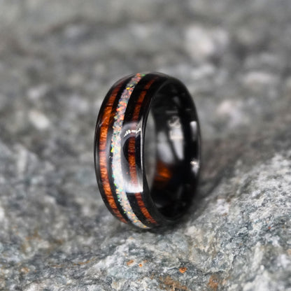 Black comfort-fit ring with double inlay, featuring wood and opal accents by Forge and Lumber. Size UK M / US 6.