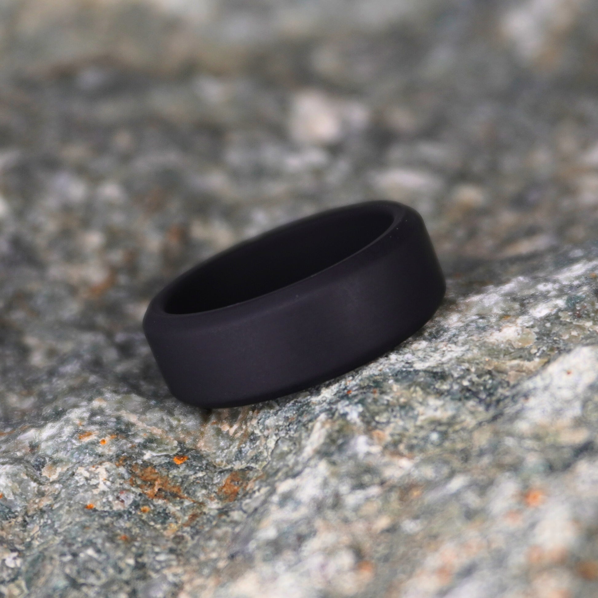 Black beveled silicone wedding ring, 8mm, by Forge and Lumber, designed for athletic and active lifestyles.