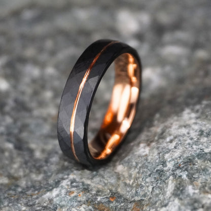 Black tungsten wedding band with rose gold accents, 6mm width, by Forge and Lumber.