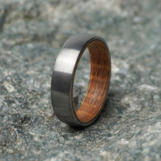 Black band ring with a 6mm width and wooden interior by Forge and Lumber.
