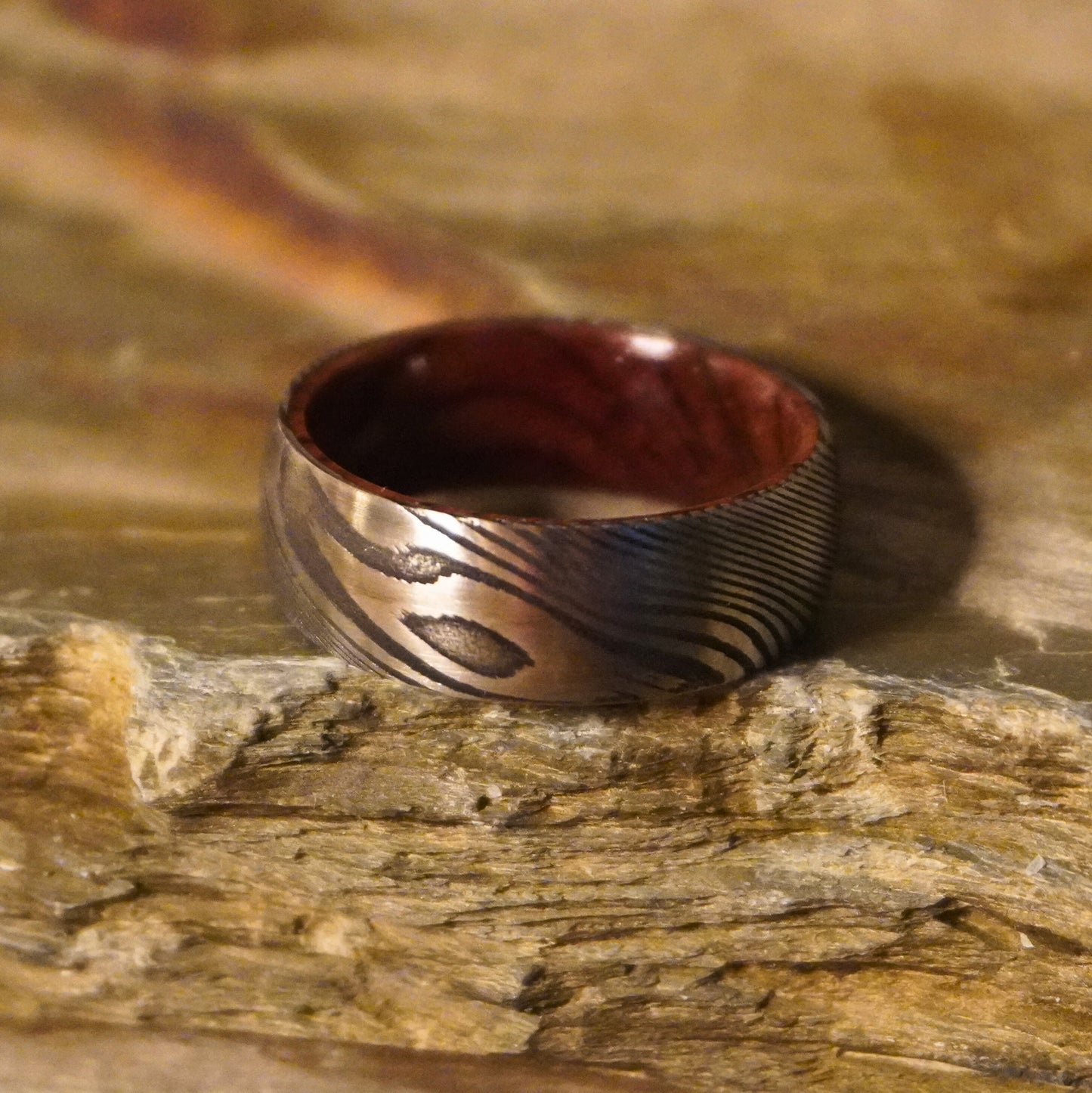 Damascus commitment ring with artisan design, featuring a wood interior, by Forge and Lumber. Size UK M / US 6.