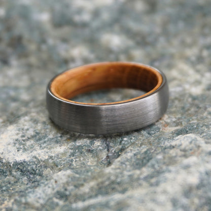 Black band ring with a brushed finish and wooden interior by Forge and Lumber. Available in sizes UK K, L, M.