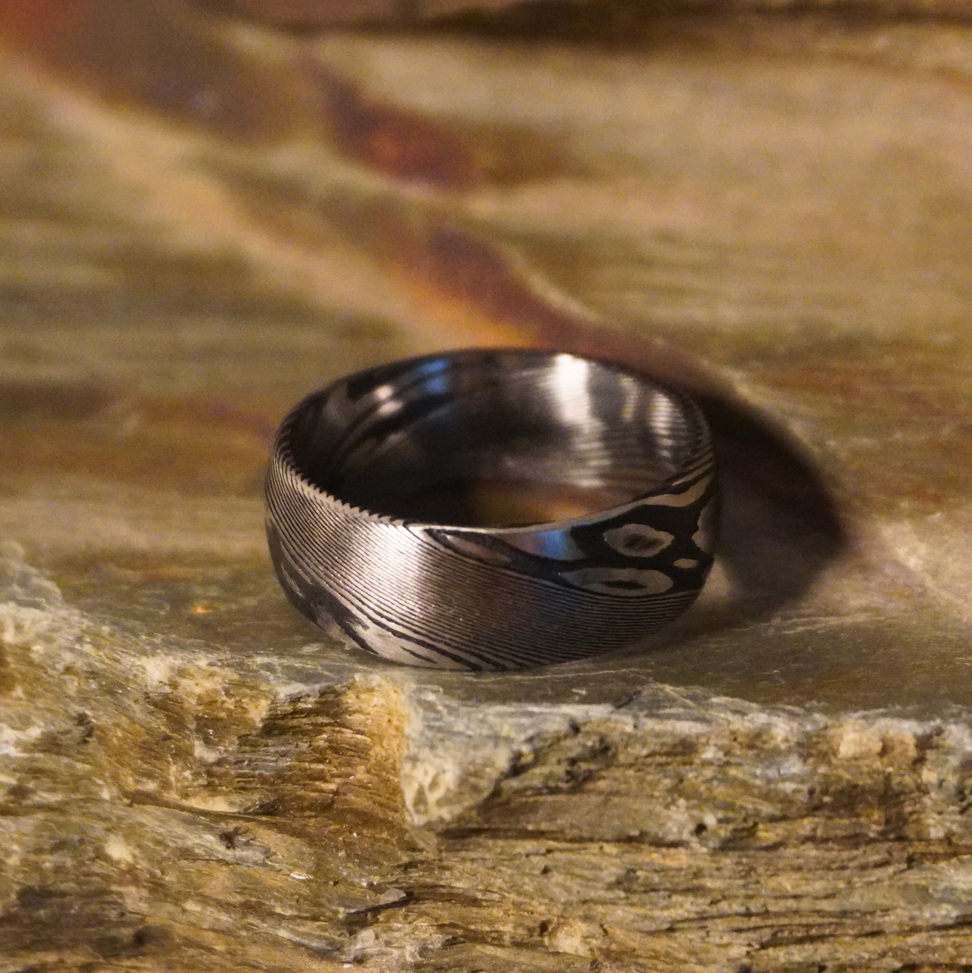 Bevelled black artisan crucible ring by Forge and Lumber, featuring intricate patterns, size UK O / US 7.