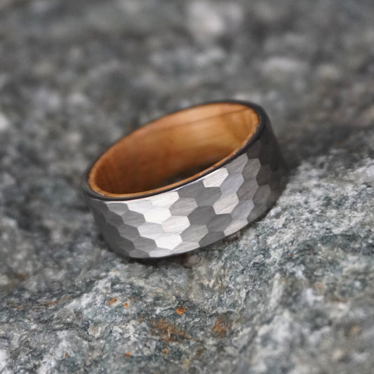 Hammered silver and black band ring with a polished finish, by Forge and Lumber. Size options available.