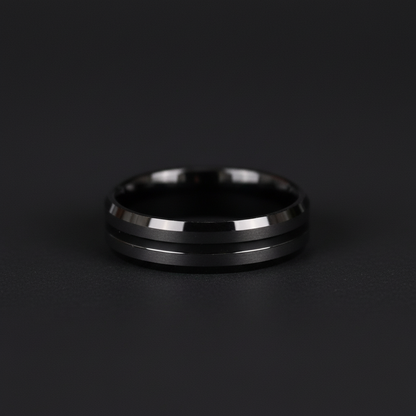 Sleek black ring with two polished silver stripes, showcasing modern design and elegance.