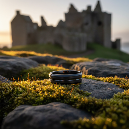 The Amar ring by Forge and Lumber, 6mm beveled band on mossy stone.