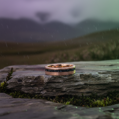 Rose gold wedding band with black and silver inlay, 6mm wide, from Forge and Lumber's Apollo collection.