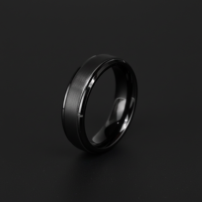 Sleek black wedding band with a brushed finish, showcasing a modern and elegant design.