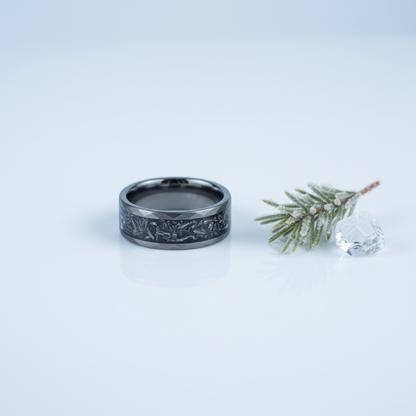 Matte black 8mm alternative metal wedding band with celestial engraving by Forge and Lumber.