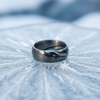 Bevelled artisan crucible ring in stainless steel with a unique swirl pattern, by Forge and Lumber, size UK O / US 7.