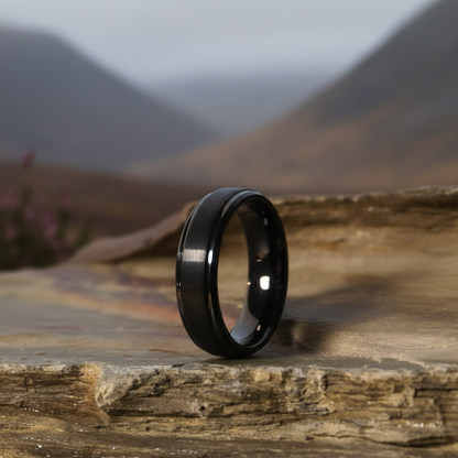 Black 6mm wedding band ring by Forge and Lumber, featuring a sleek matte finish and lightweight design.