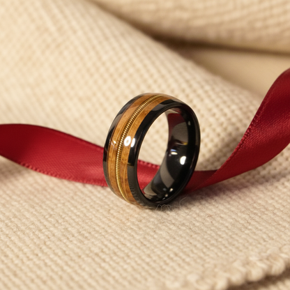 Black ceramic wedding band with gold inlay by Forge and Lumber, size UK M / US 6.