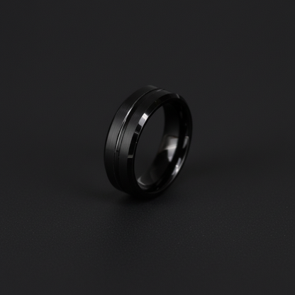 Sleek black ring with a polished finish and subtle grooves, showcasing modern elegance in "The Waka."